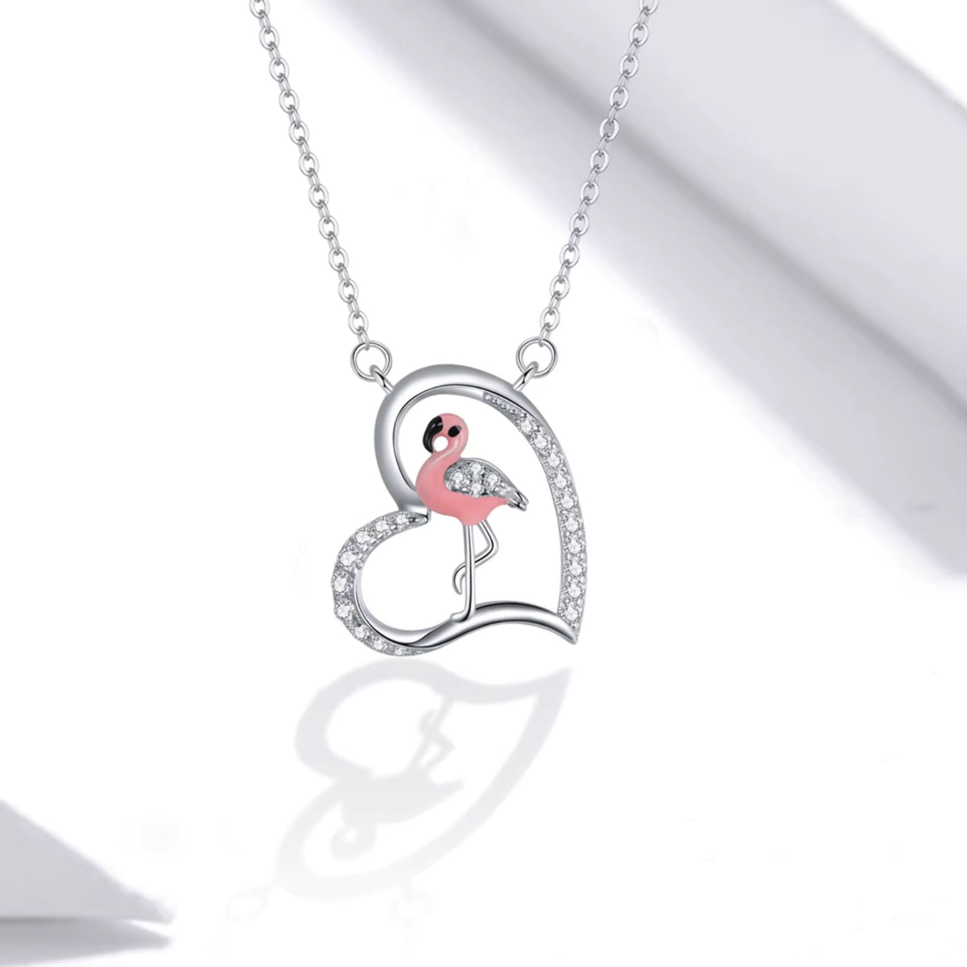 Necklace with a flamingo pendant on a white background