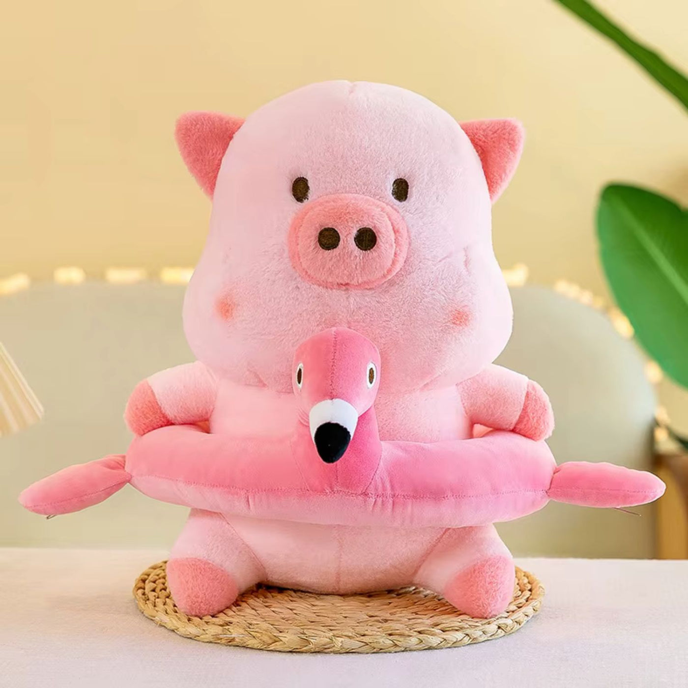 Pink plush toy with pig and flamingo design