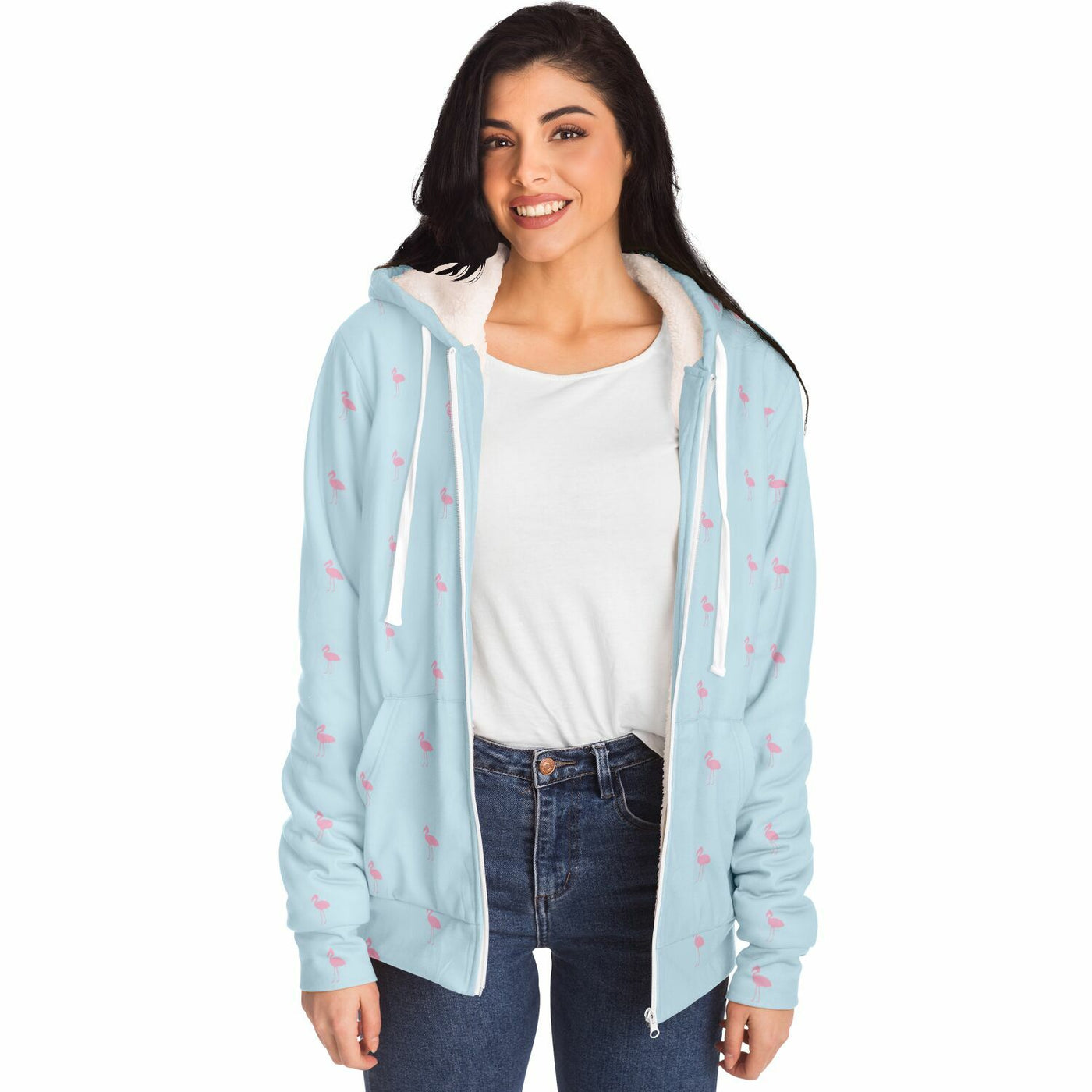 Woman wearing a light blue hoodie with pink patterns on a white background