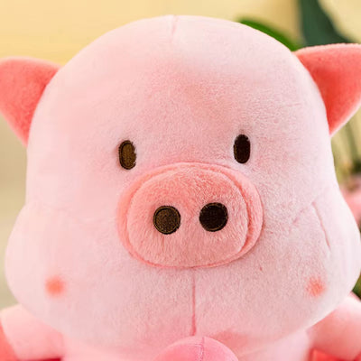 Close-up of a pink plush pig toy with a blurred background