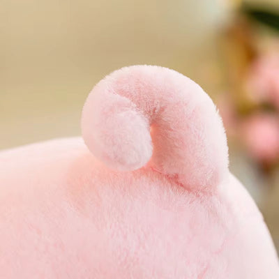 Close-up of a pink plush toy with a blurred background