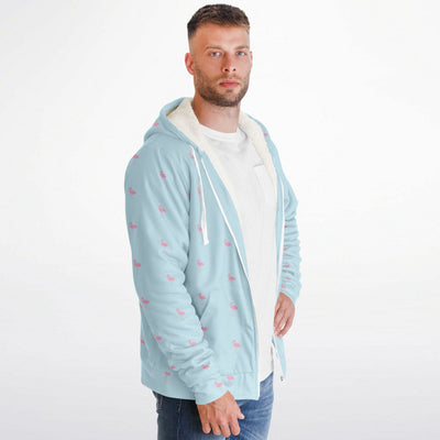 Man wearing a light blue hoodie with small red hearts on a white background