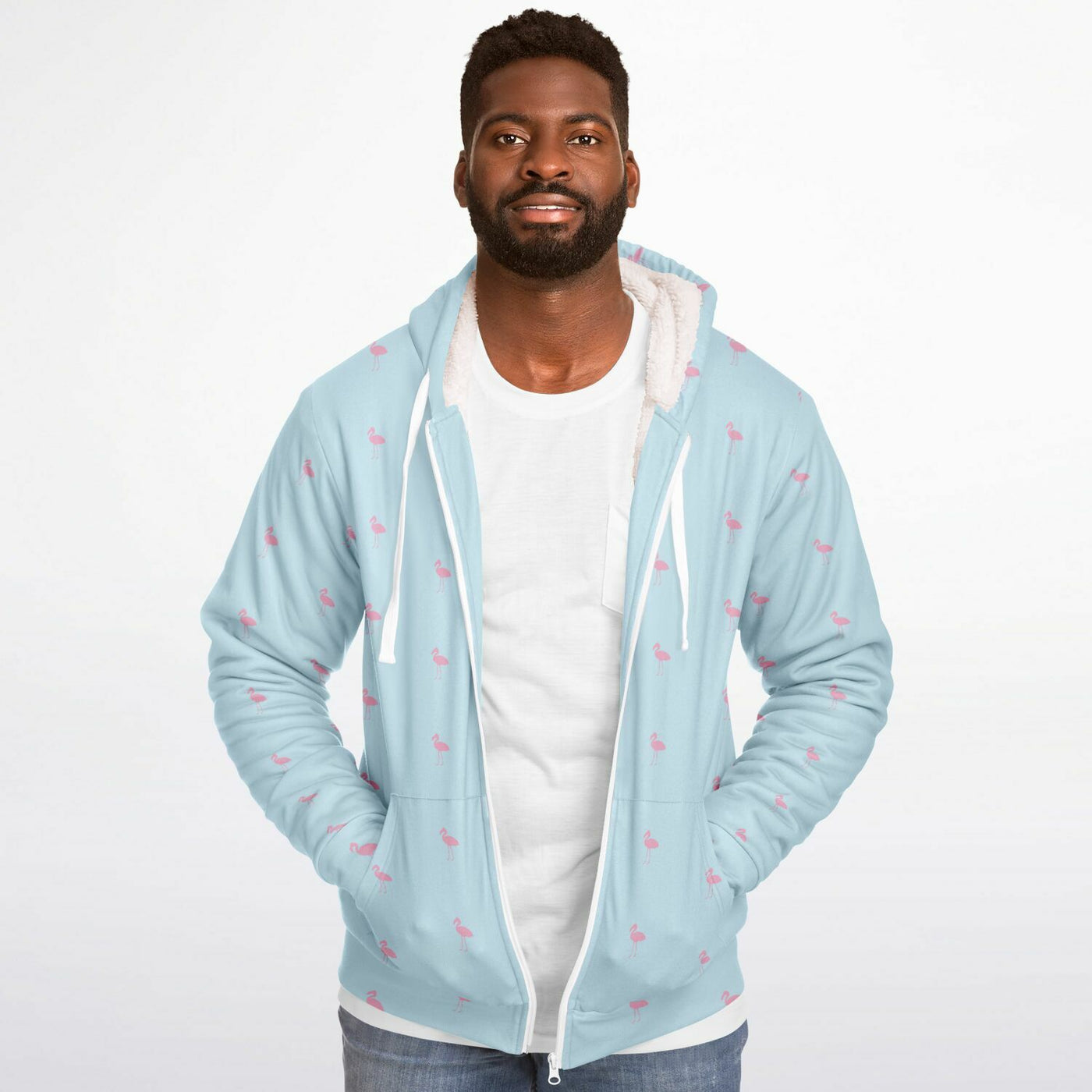 Man wearing a light blue hoodie with pink patterns on a white background
