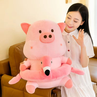 Woman holding a large flamingo plush pig toy