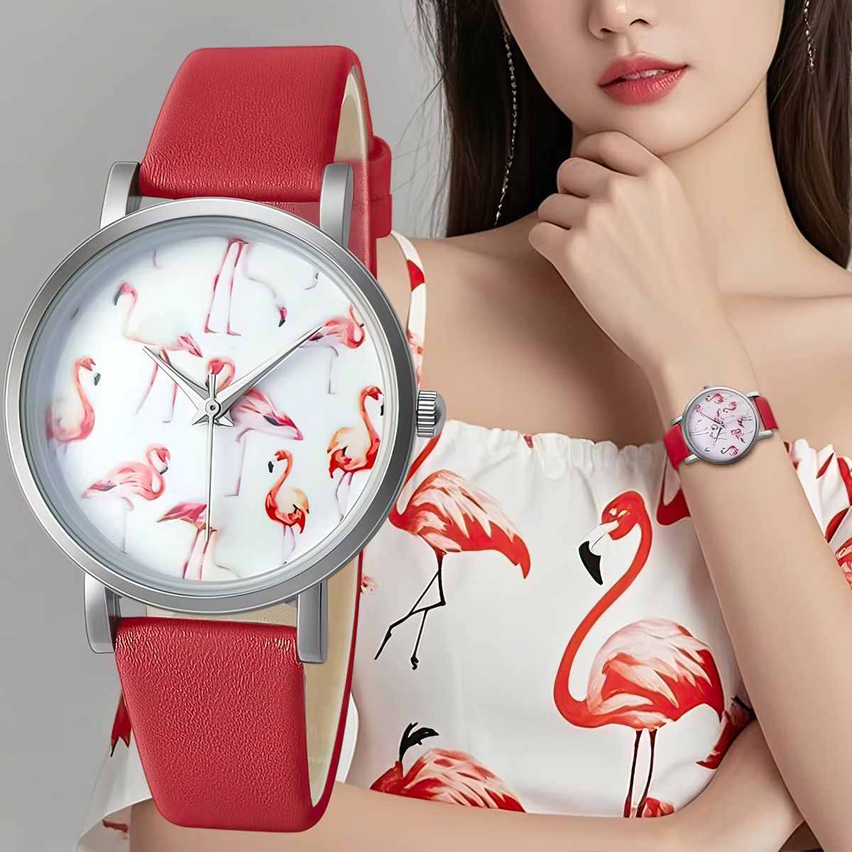 Woman wearing a watch with flamingo design and red strap, close-up of watch face.