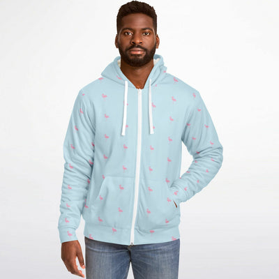 Man wearing a light blue hoodie with small patterns on a white background