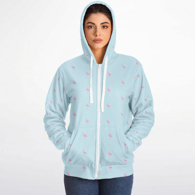 Light blue hoodie with small pink patterns worn by a person on a white background